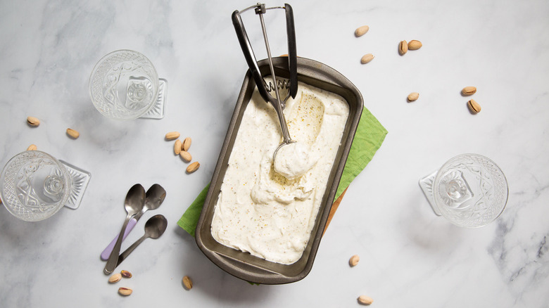 Ice cream in loaf pan with scoop inside