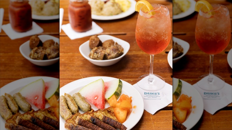 Assortment of brunch dishes and cocktails on wood table