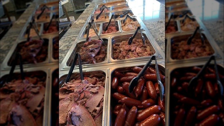 BBQ buffet line with assorted meats and sausage