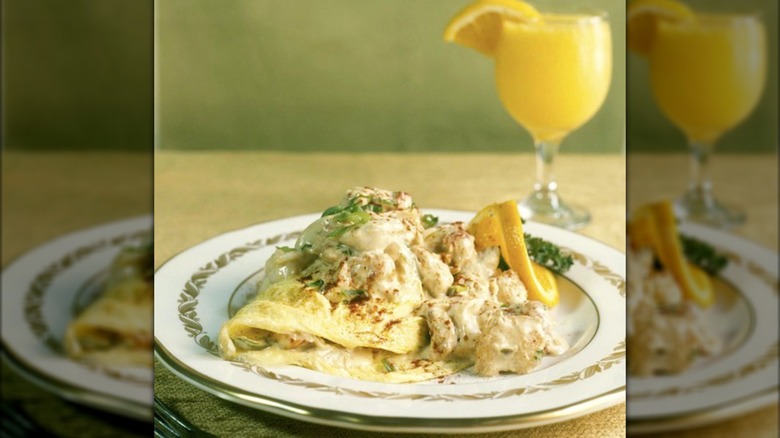 OMelet on plate with cocktail in background