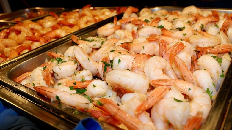 Trays of shimp on a buffet table