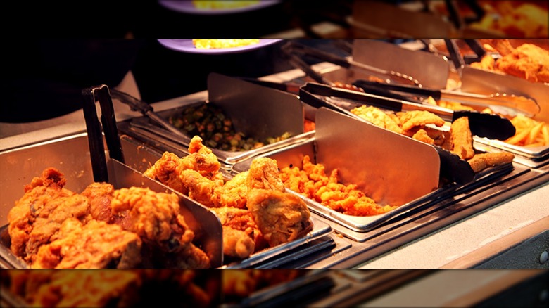 Buffet with trays of fried foods