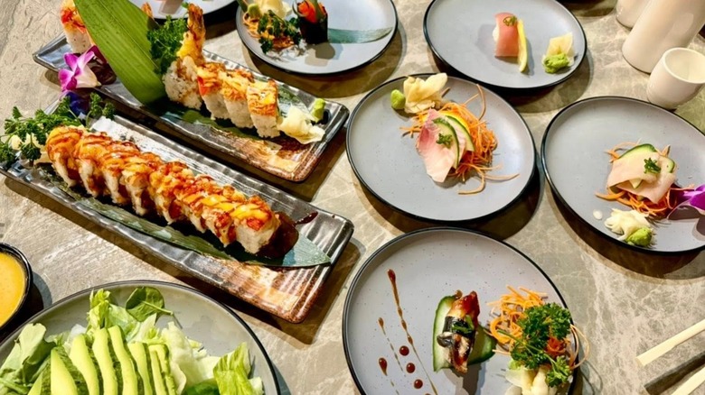 Assortment of schi on trays and small plates