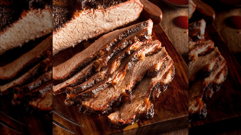 Sliced brisket on wooden board
