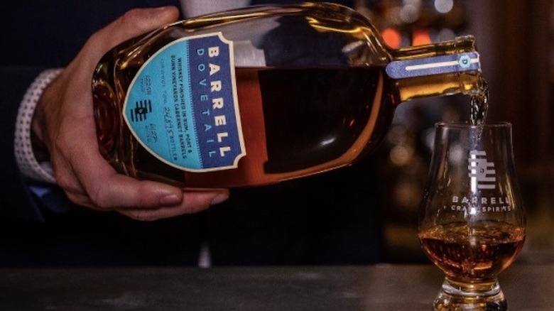 Barrell whiskey bottle poured into glass