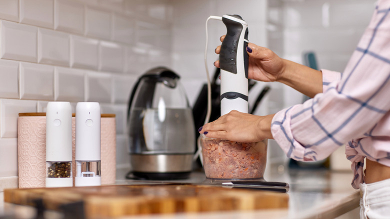 blending raw meat in a food processor