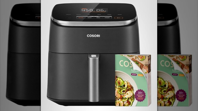 The Cosori 9-in-1 TurboBlaze Air Fryer and its included recipe book shown on a plain background