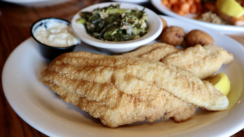 Cracker Barrel fried catfish with collard greens on a plate