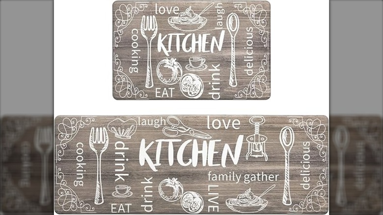 Two anti-fatigue mats in grey decorated with kitchen utensils and cooking words.