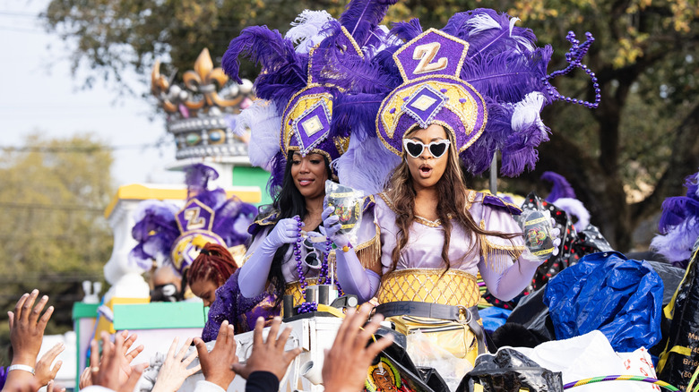 New Orleans krewe members in costume on a float.