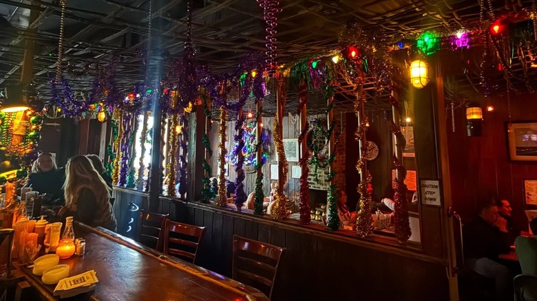 The interior of Port Of Call bar decked with beads and decorations.