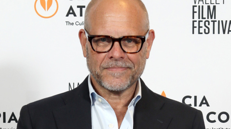 Alton Brown smiling in suit