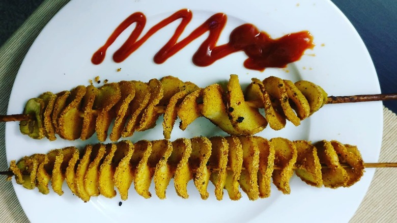 Tornado-style potatoes on a plate with ketchup