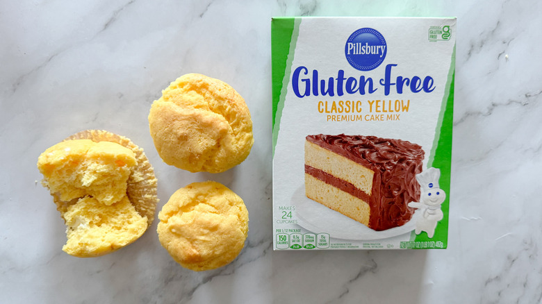 Pillsbury gluten-free cake mix and cupcakes on marble surface