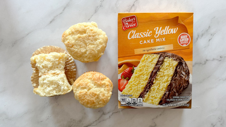 Baker's Corner yellow cake mix and cupcakes on marble surface