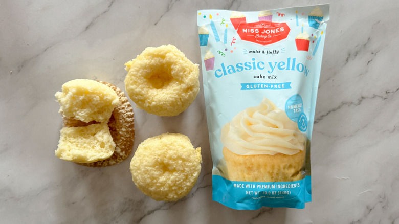 Miss Jones classic yellow cake mix with cupcakes on marble surface
