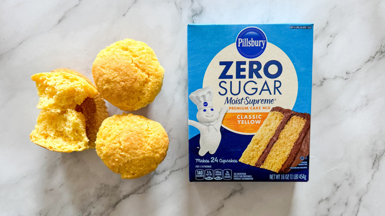 Pillsbury zero-sugar yellow cake mix with cupcakes on marble surface
