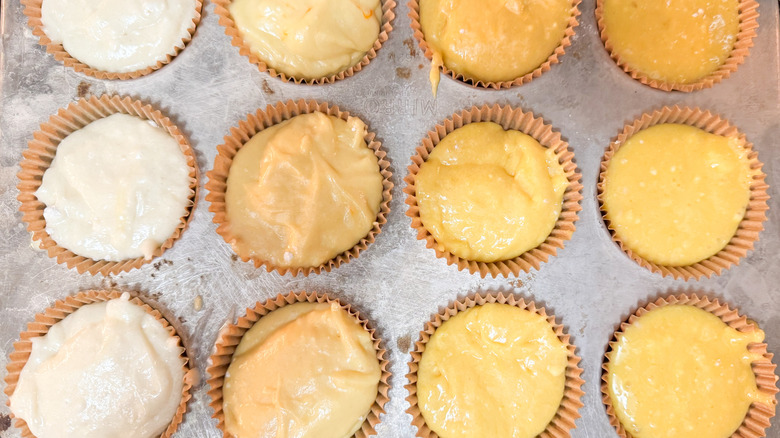 Metal cupcake tin with filled wells of cake batter