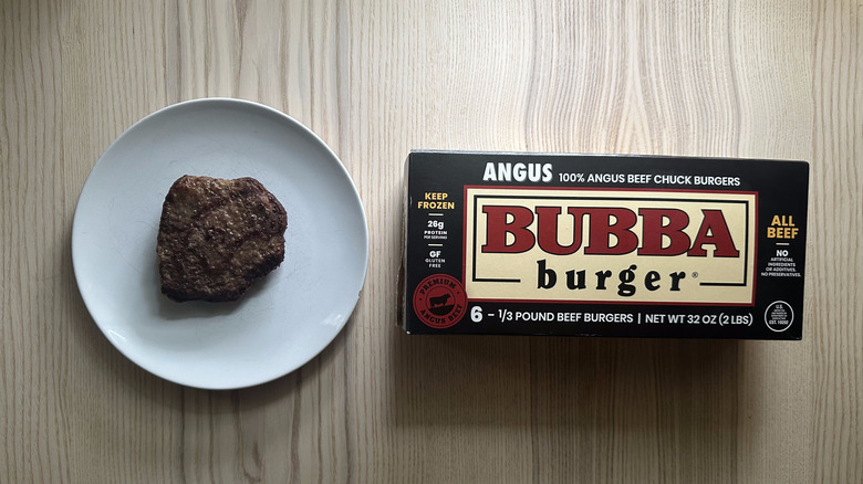 Angus Bubba Burger on a plate beside a box
