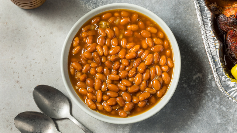 Top-view of American baked beans in a white bowl
