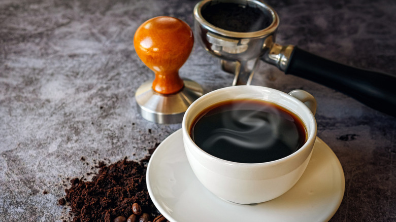 ground coffee with mug