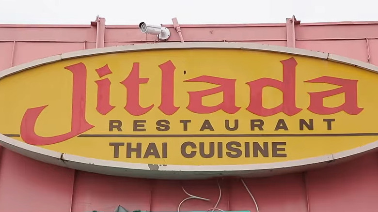 The exterior sign for the Thai restaurant Jitlada, seen during daytime in Los Angeles