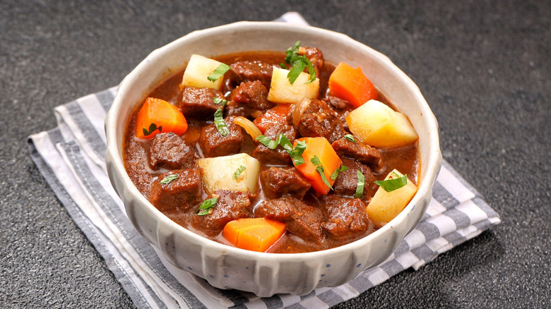 Bowl of beef stew with carrots and potatoes