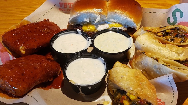 Chili's Tripple Dipper with southwestern eggrolls, saucy mozzarella sticks, sliders, and 3 sauces