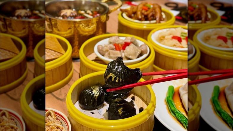 Chinese dishes and chopsticks holding dumplings at Easy Joy
