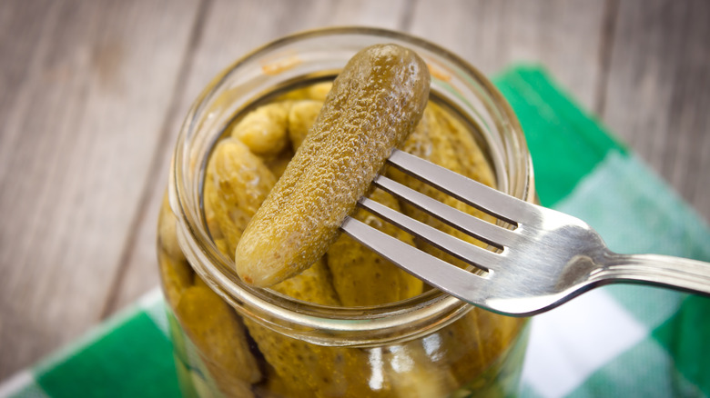Crunchy pickles in jar