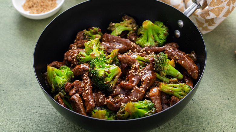 Beef and broccoli in wok