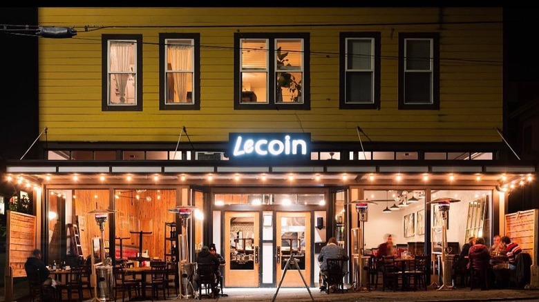 Seattle date night restaurant in Fremont with yellow exterior and outdoor tables