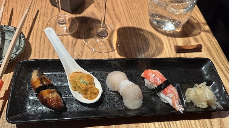 Lineup of date night omakase for couples in Seattle on a wooden table
