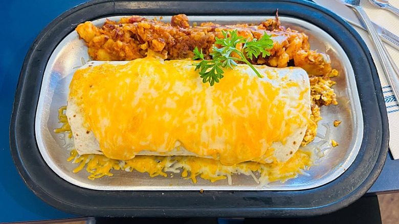 Breakfast burrito topped with melted cheese at The Pantry