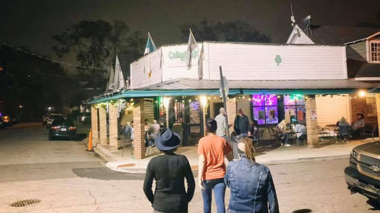 People walking toward Callaghan's Irish Social Club