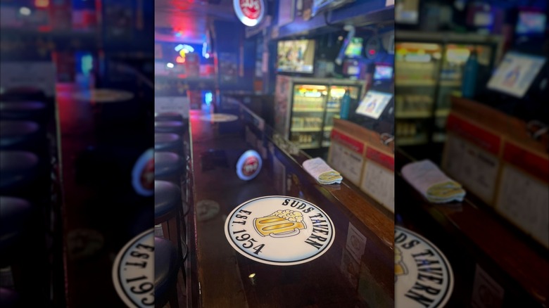bar top at Suds Tavern with branded coasters