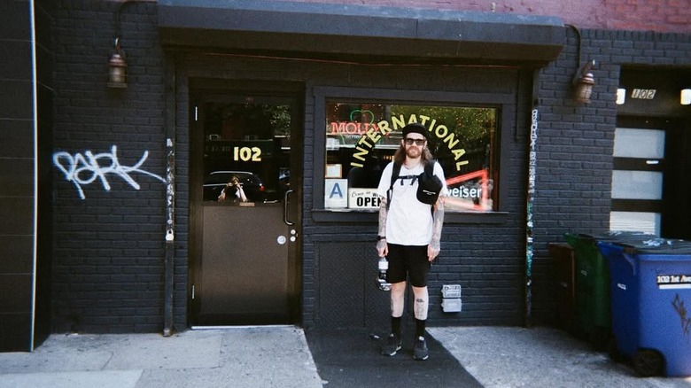 Person standing outside International Bar