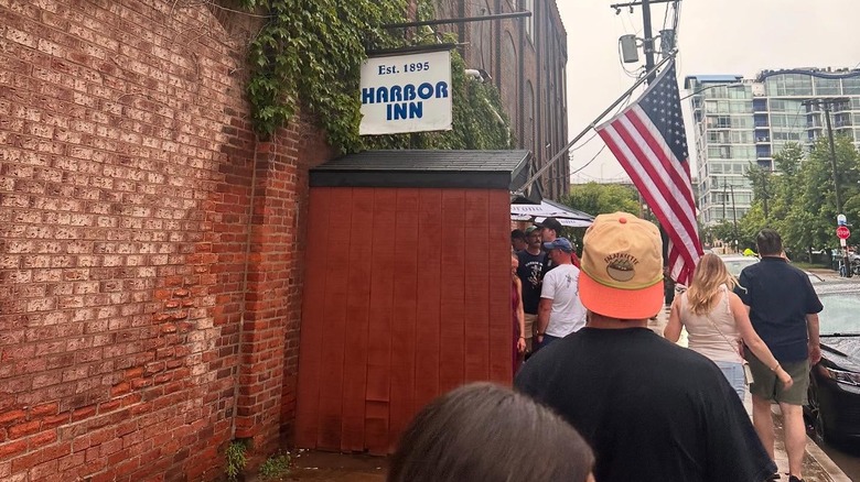 People linging up outside the Habor Inn cafe