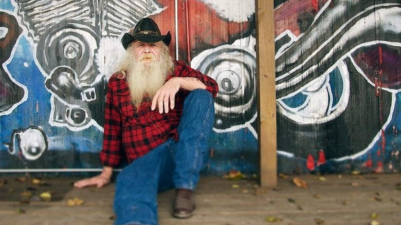 Man sitting on the ground at Santa's Pub