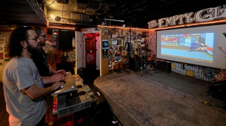 People playing a video game at the Empty Glass