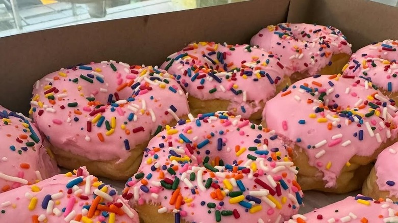 Donuts with pink frosting and sprinkles
