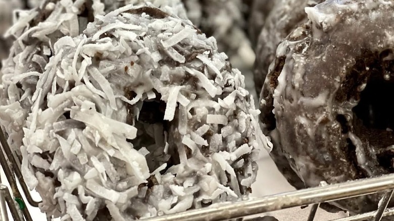 Coconut chocolate donuts displayed at store