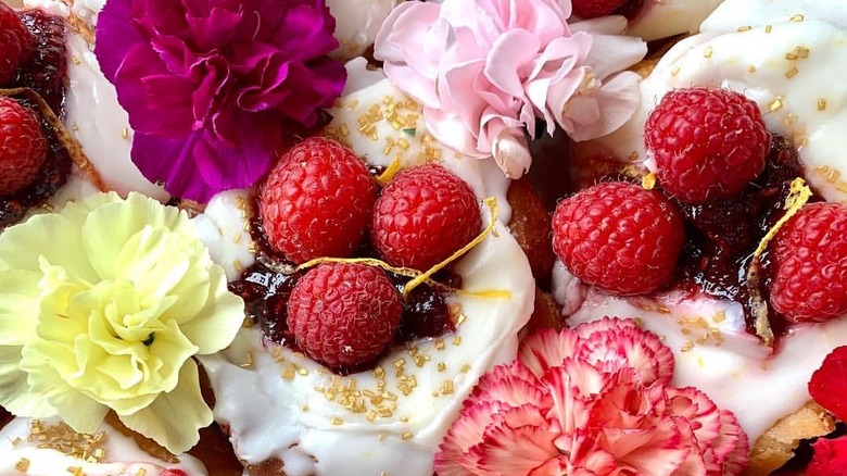 Decorated donuts with fruit and flowers