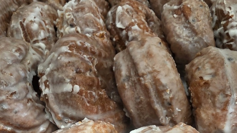 Rows of donuts covered in glaze
