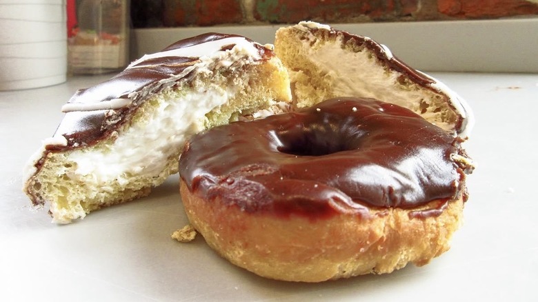 Chocolate-glazed doughnut and cream-filled doughnut with chocolate glaze