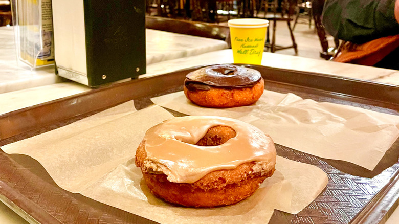 Cake doughnuts frosted with maple and chocolate