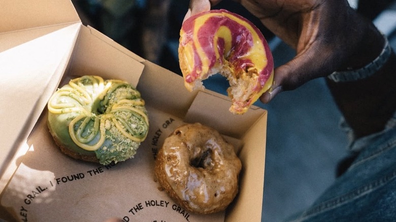 Doughnuts made with pandan, dragonfruit-passion fruit, and miso honey
