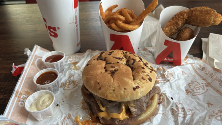 Arby's Double Beef and Cheddar beside sides on wrapper