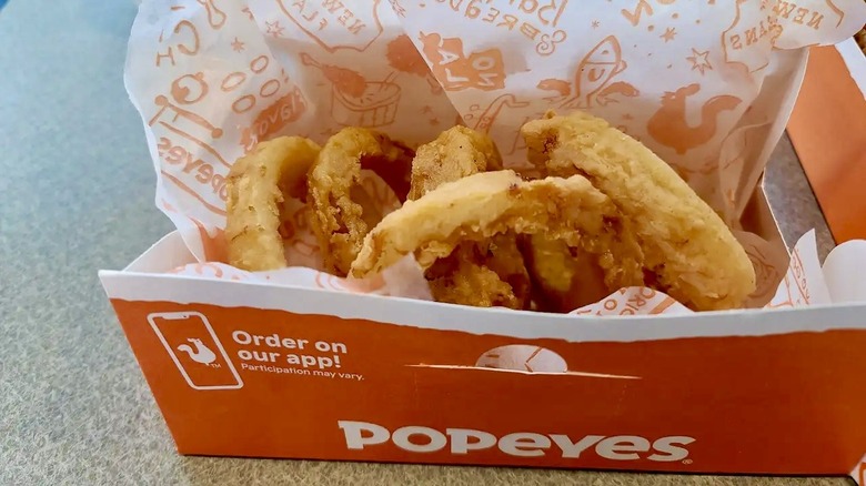 A box of Popeyes Onion Rings
