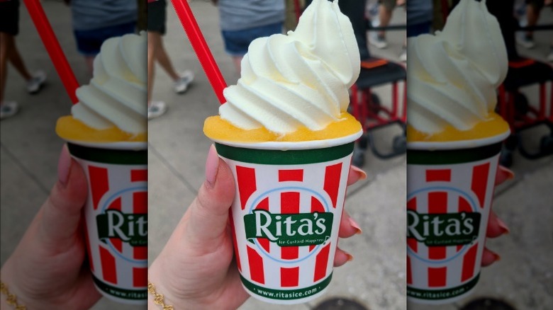 Hand holding a Rita's Mango Gelati